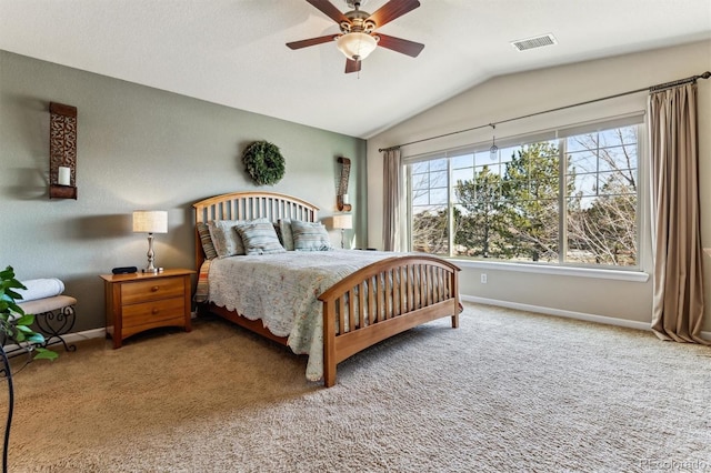 carpeted bedroom featuring ceiling fan and vaulted ceiling