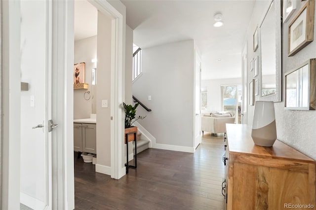 corridor with dark hardwood / wood-style flooring