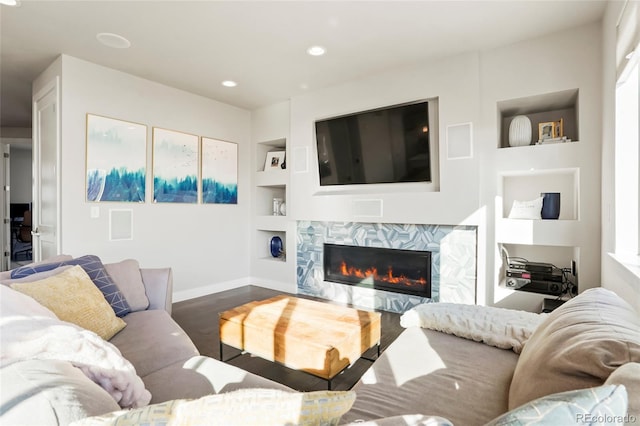 living room with dark wood-type flooring and built in features