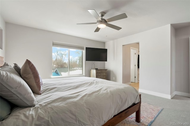 bedroom featuring light carpet and ceiling fan