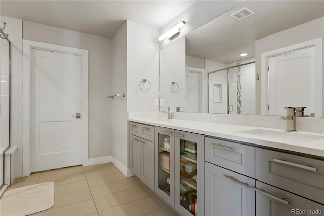 bathroom featuring tile patterned flooring, vanity, a shower with door, and beverage cooler