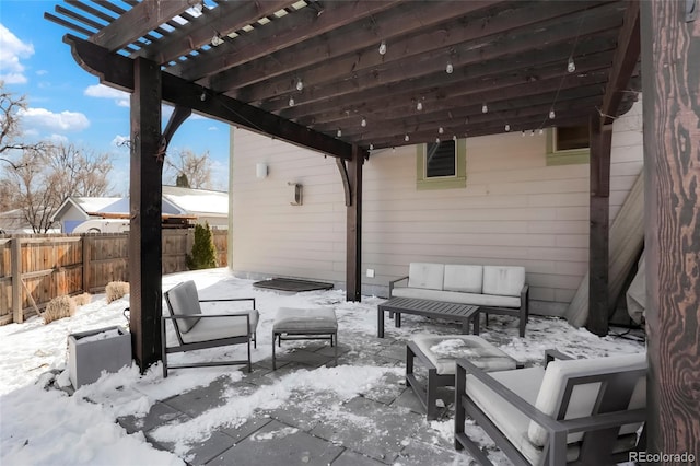 snow covered patio featuring a pergola