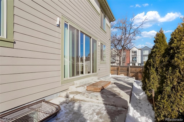 view of side of home with a patio