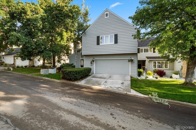 view of front of house featuring a garage and a front yard