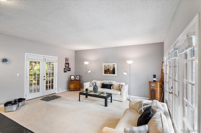 carpeted living room featuring a textured ceiling and french doors