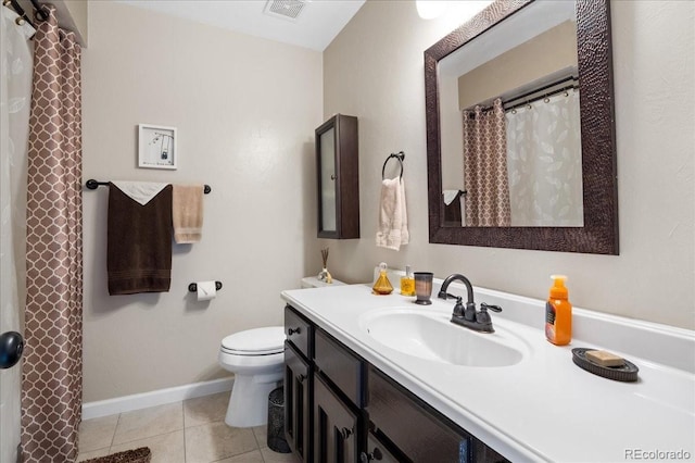 bathroom with tile patterned floors, toilet, and vanity