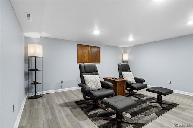 sitting room with light hardwood / wood-style floors