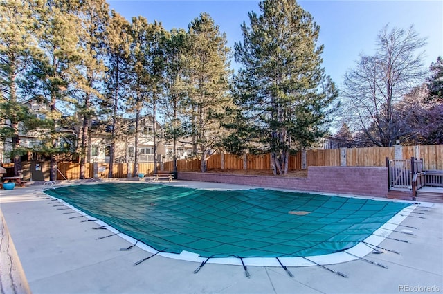 view of swimming pool featuring a patio