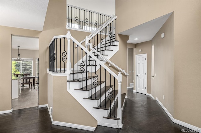 8410 S Oak St, Littleton, CO 80127 - stairway with a towering ceiling and wood finished floors