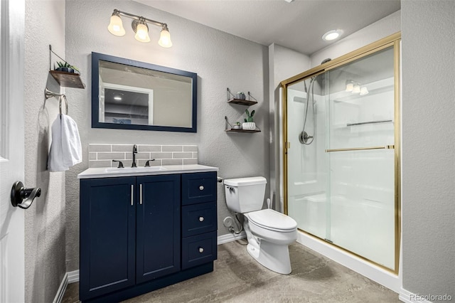 8410 S Oak St, Littleton, CO 80127 - full bathroom featuring a shower stall, vanity, a textured wall, and decorative backsplash