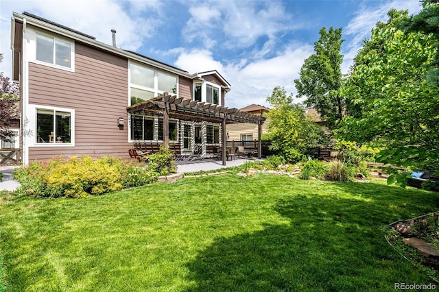 8410 S Oak St, Littleton, CO 80127 - back of house with a pergola, a patio area, and a lawn
