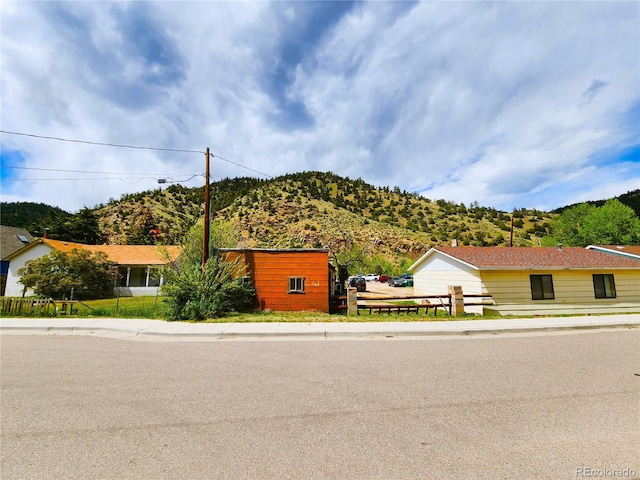 view of front of property with a mountain view