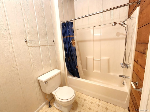 bathroom with toilet, tile patterned flooring, and shower / tub combo