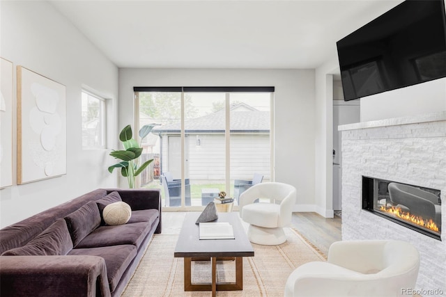 2435 S High St, Denver, CO 80210 - living area featuring a stone fireplace and wood finished floors