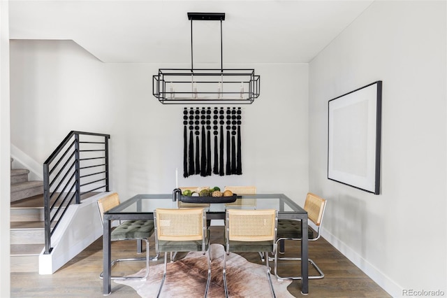 2435 S High St, Denver, CO 80210 - dining space featuring wood finished floors, stairway, and baseboards