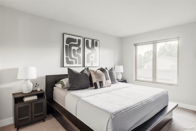 2435 S High St, Denver, CO 80210 - bedroom featuring light carpet and baseboards
