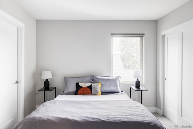 2435 S High St, Denver, CO 80210 - bedroom with light colored carpet and baseboards