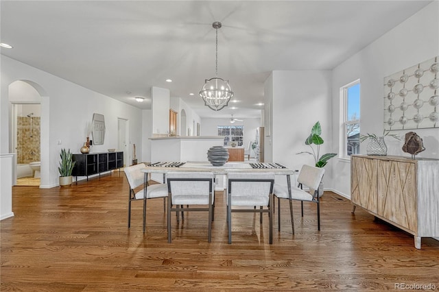 dining room featuring plenty of natural light, dark hardwood / wood-style floors, and a notable chandelier