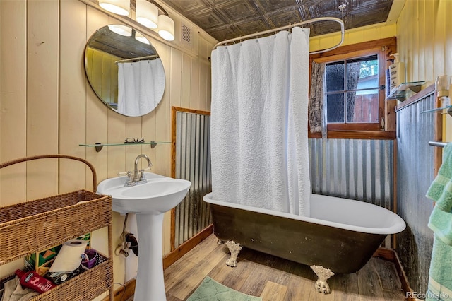 500 Fourth St, Fairplay, CO 80440 - full bath featuring an ornate ceiling, wood finished floors, a freestanding tub, and wooden walls