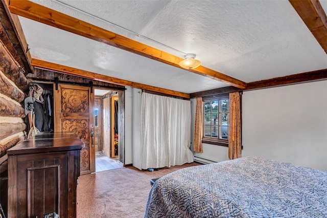500 Fourth St, Fairplay, CO 80440 - bedroom with carpet flooring, beam ceiling, a textured ceiling, a baseboard radiator, and a barn door
