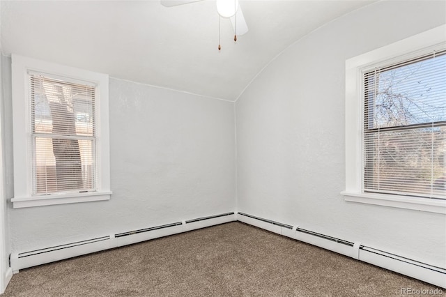 additional living space featuring carpet floors, a baseboard radiator, ceiling fan, and lofted ceiling