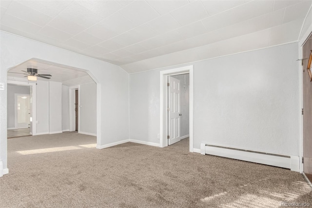 unfurnished room with carpet floors, baseboard heating, and ceiling fan