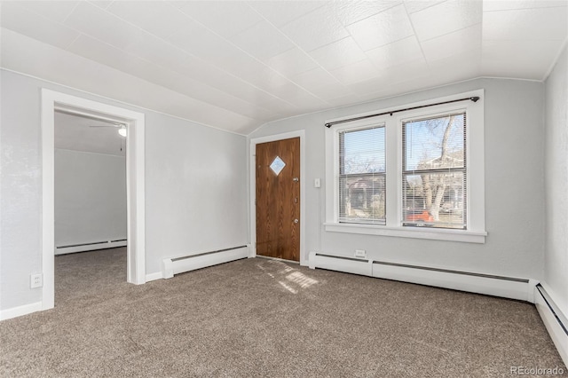 interior space featuring carpet floors, a baseboard radiator, and vaulted ceiling