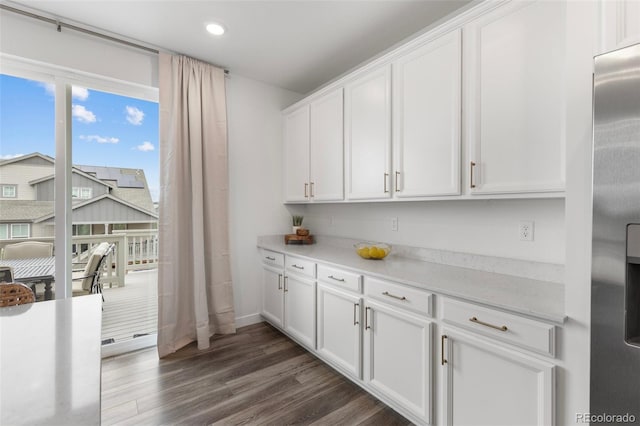 12940 Brier Ct, Firestone, CO 80504 - kitchen with light countertops, white cabinetry, dark wood-type flooring, recessed lighting, and stainless steel fridge with ice dispenser