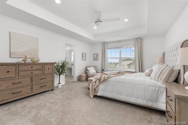 12940 Brier Ct, Firestone, CO 80504 - bedroom with a raised ceiling, light carpet, recessed lighting, ceiling fan, and connected bathroom
