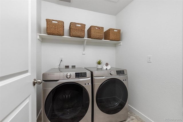 12940 Brier Ct, Firestone, CO 80504 - laundry area with washing machine and clothes dryer and baseboards