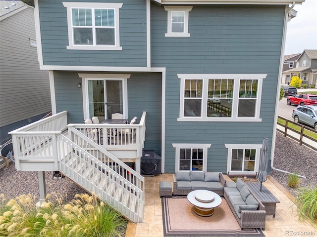 12940 Brier Ct, Firestone, CO 80504 - rear view of property featuring outdoor lounge area, a patio, and a wooden deck