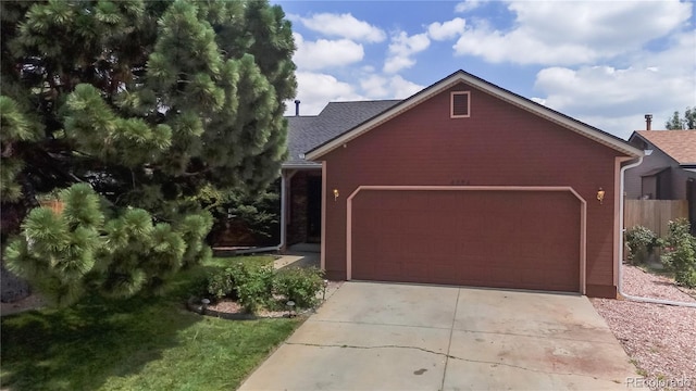 4396 Dearborn St, Denver, CO 80239 - garage featuring concrete driveway