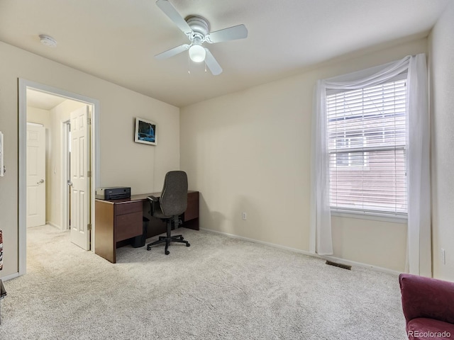 carpeted office with ceiling fan