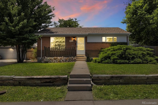 1760 W 74th Way, Denver, CO 80221 - view of front facade with brick siding and a garage