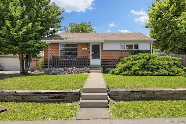 1760 W 74th Way, Denver, CO 80221 - view of front of home featuring brick siding and a front lawn