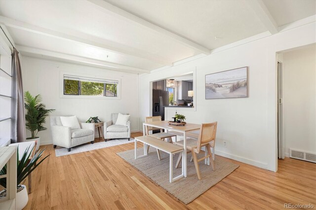 1760 W 74th Way, Denver, CO 80221 - dining area with beamed ceiling and light wood finished floors