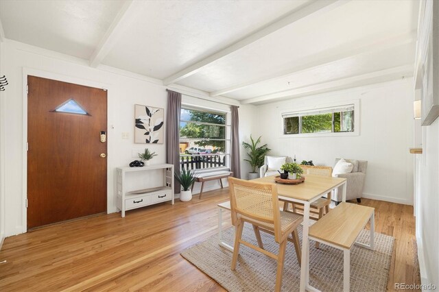 1760 W 74th Way, Denver, CO 80221 - dining space featuring beamed ceiling, light wood-style floors, and plenty of natural light