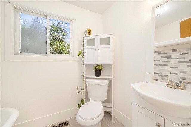 1760 W 74th Way, Denver, CO 80221 - bathroom featuring decorative backsplash and vanity