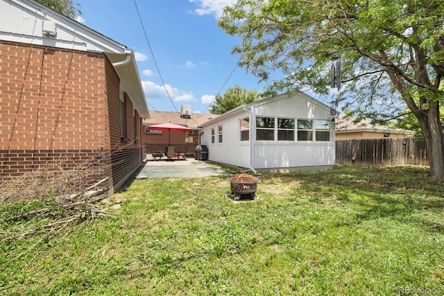 1760 W 74th Way, Denver, CO 80221 - view of yard featuring an outdoor fire pit and a patio