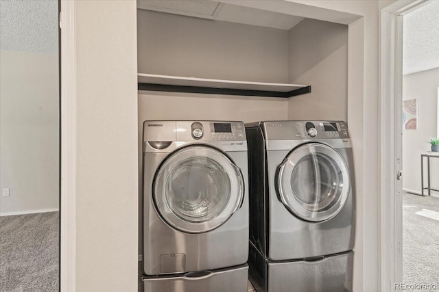 laundry room featuring independent washer and dryer and carpet flooring