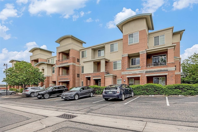 4100 Albion St Unit 617, Denver, CO 80216 - view of property featuring uncovered parking