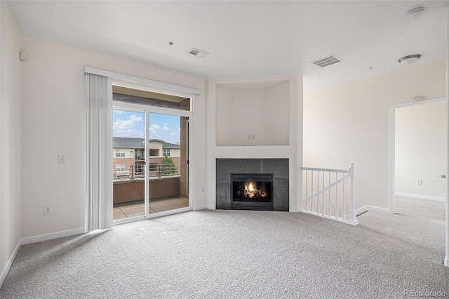 4100 Albion St Unit 617, Denver, CO 80216 - unfurnished living room with carpet flooring, a fireplace, and baseboards