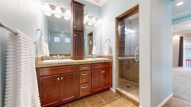 18009 E 47th Pl, Denver, CO 80249 - bathroom featuring a stall shower, tile patterned flooring, double vanity, and plenty of natural light