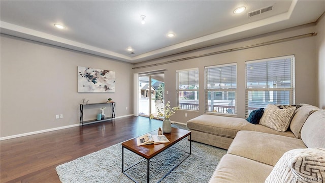 18009 E 47th Pl, Denver, CO 80249 - living area featuring a tray ceiling, wood finished floors, baseboards, and recessed lighting