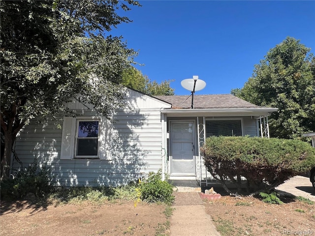 view of front of property with a shingled roof