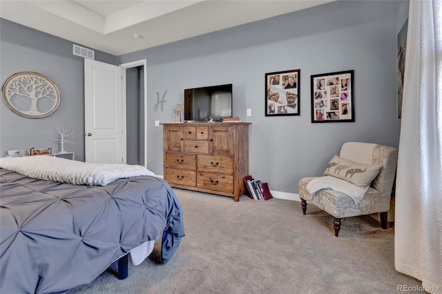 carpeted bedroom with baseboards and visible vents