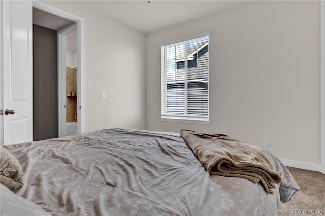 bedroom featuring carpet floors and baseboards
