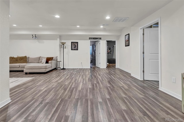 living room with baseboards, recessed lighting, wood finished floors, and visible vents