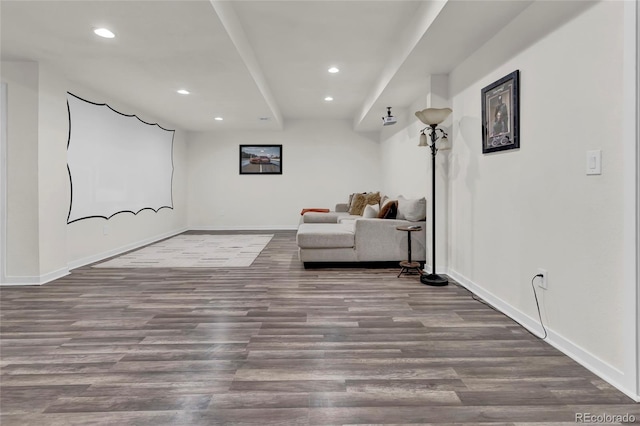 living area with baseboards, recessed lighting, and wood finished floors