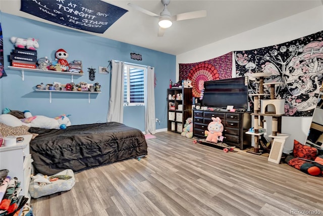 bedroom featuring ceiling fan and wood finished floors